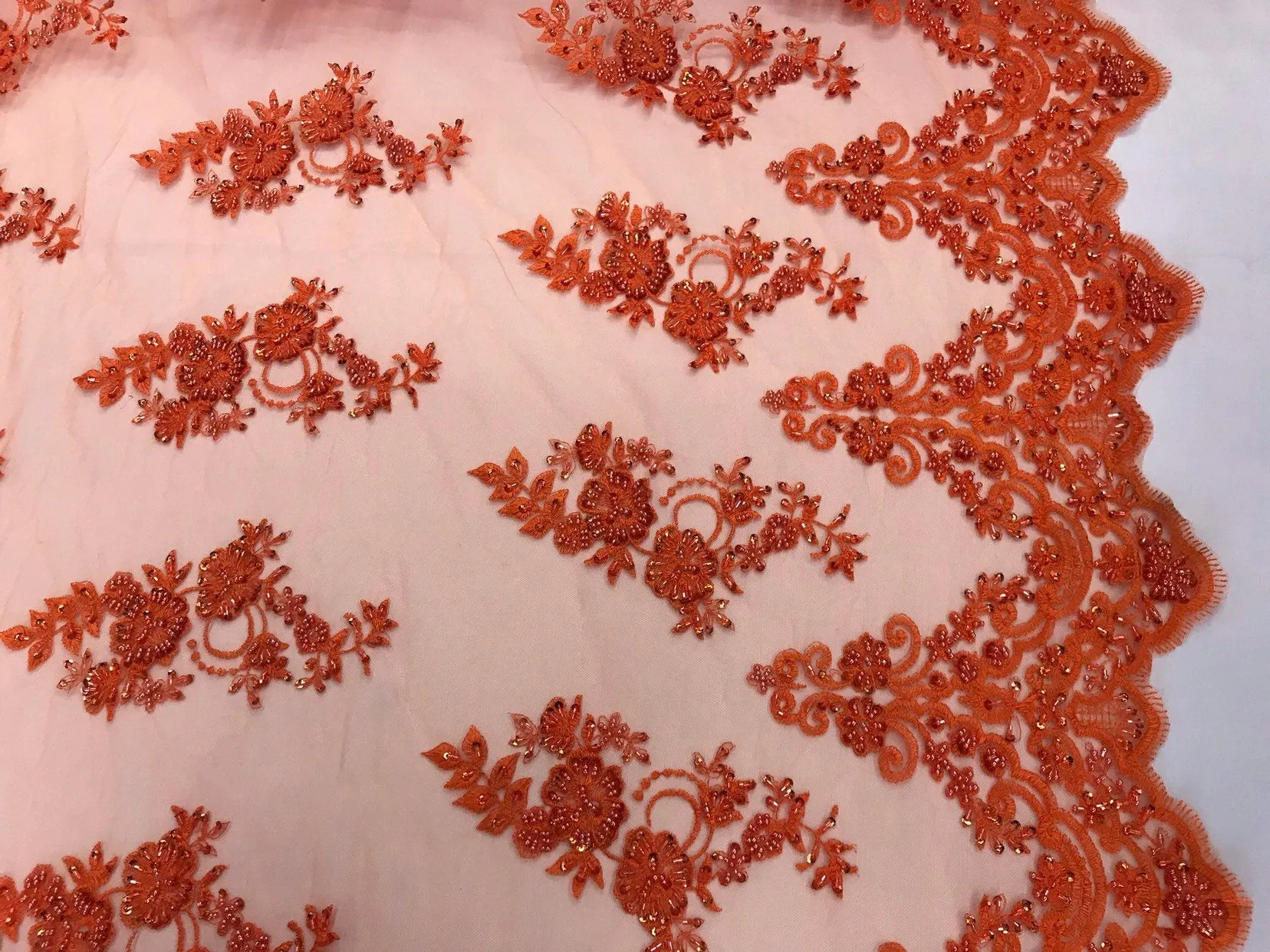 Orange hand beaded floral design embroidery with shiny sequins on a mesh lace-dresses-apparel-fashion-prom-nightgown-sold by the yard.